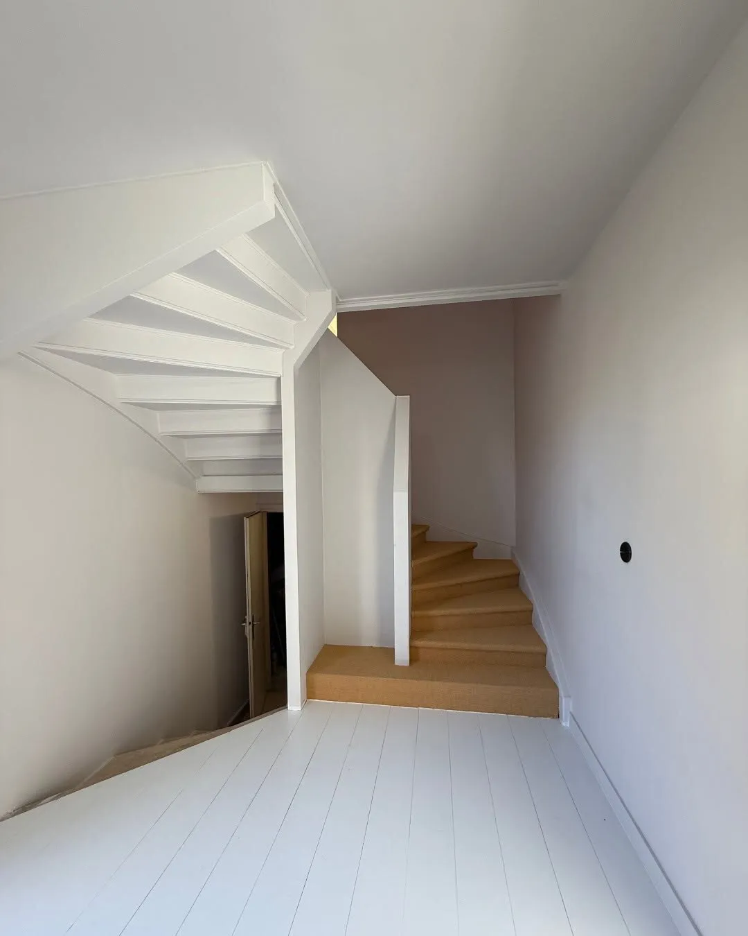 Renovated staircase with timber and carpet finishes